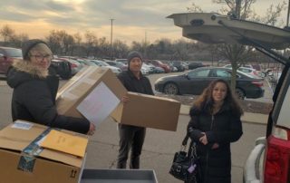 Delaney Gloger, Scott Schmaltz & Aubreigh Sabbota – packing the cars to deliver the gifts