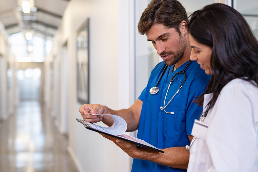 Doctors looking at a chart